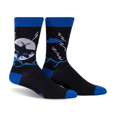 front view of a pair of black socks with blue and white details. the socks have a graphic of a bat flying in front of a moon, mountains, and lightning.