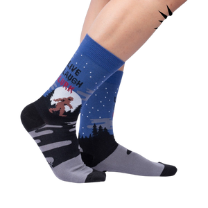 Lifestyle shot: Model wearing the 'Live, Laugh, Lurk' socks, showcasing their fit and design.