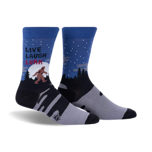 blue crew socks featuring bigfoot silhouette, fir tree pattern and text 'live, laugh, lurk'.  