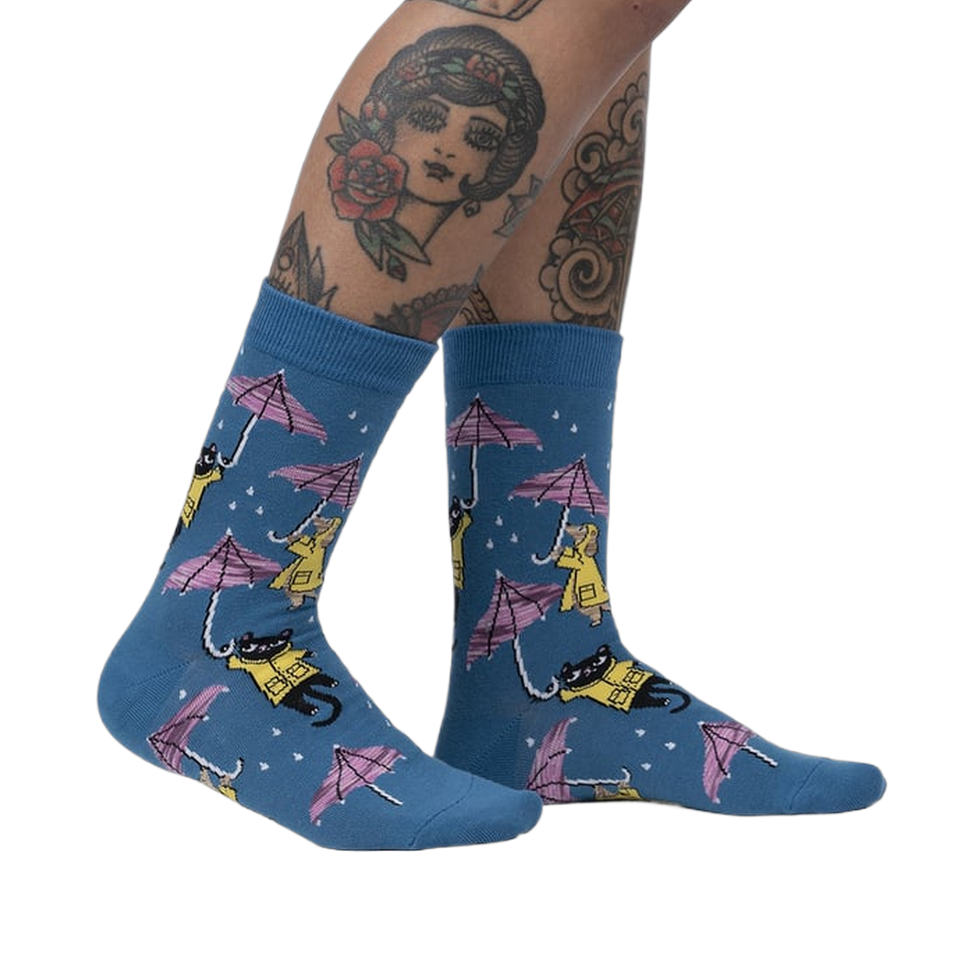 Lifestyle shot showcasing the 'Petting in the Rain' socks on a model's legs.