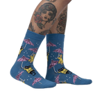 Lifestyle shot showcasing the 'Petting in the Rain' socks on a model's legs.