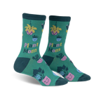 Pair of women's crew socks. Green background with illustrations of potted plants, cacti, and flowers with happy faces. Text reads 'Plant Mom'.