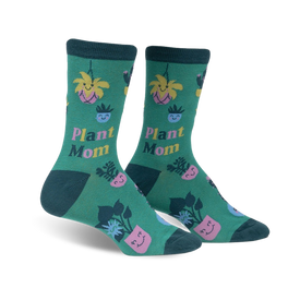 women's knee-high crew socks in dark green with pink, blue and yellow pots and smiley-face plants.   