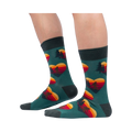 Lifestyle shot showing the socks on a person's legs; teal socks with Sasquatch and sunset heart design.