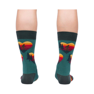 Rear view of the teal socks, showcasing the back and heel; the design is visible on the back of the socks.