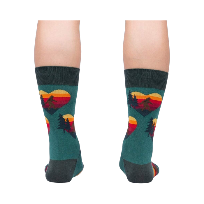 Rear view of the teal socks, showcasing the back and heel; the design is visible on the back of the socks.