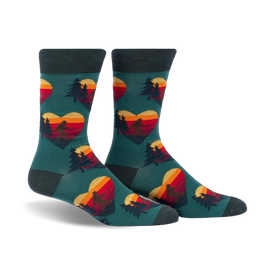 crew length, men's socks with a pattern of hearts with a sasquatch silhouette in each heart walking through pines with a sunset.  
