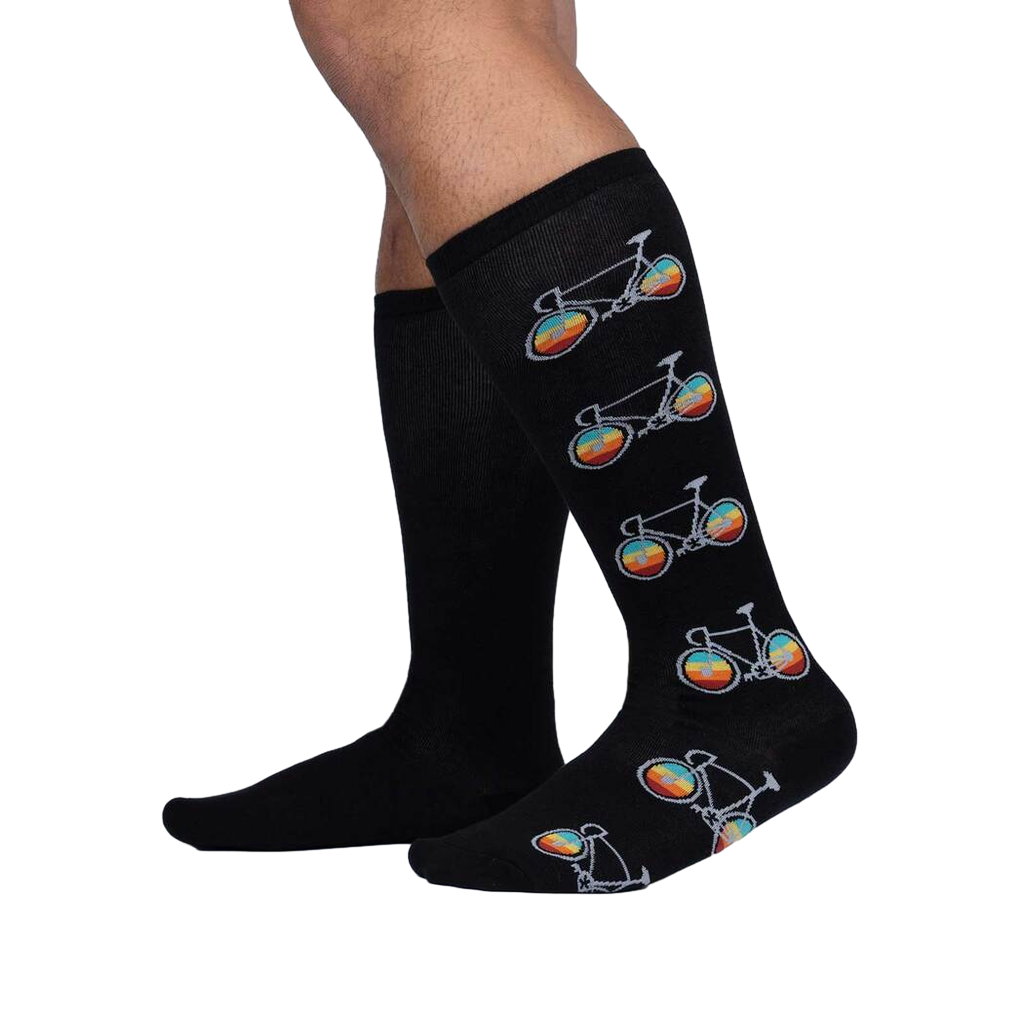 Pedal Power socks shown on a model's legs, showcasing the fit and design on the lower leg.