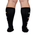 Rear view of Pedal Power socks on a model, highlighting the full design placement on the back of the legs.