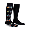 Pair of black knee-high socks with repeating patterns of retro-colored bicycles. 
