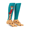 Pair of teal and tan knee-high socks featuring a whimsical giraffe design wearing a red scarf.