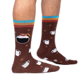 Lifestyle shot of a person wearing the 'Pot Head' socks, showing how they look on feet.
