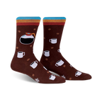 A pair of brown crew socks with a colorful stripe at the top. The socks feature a design of coffee pots, mugs, and coffee beans.