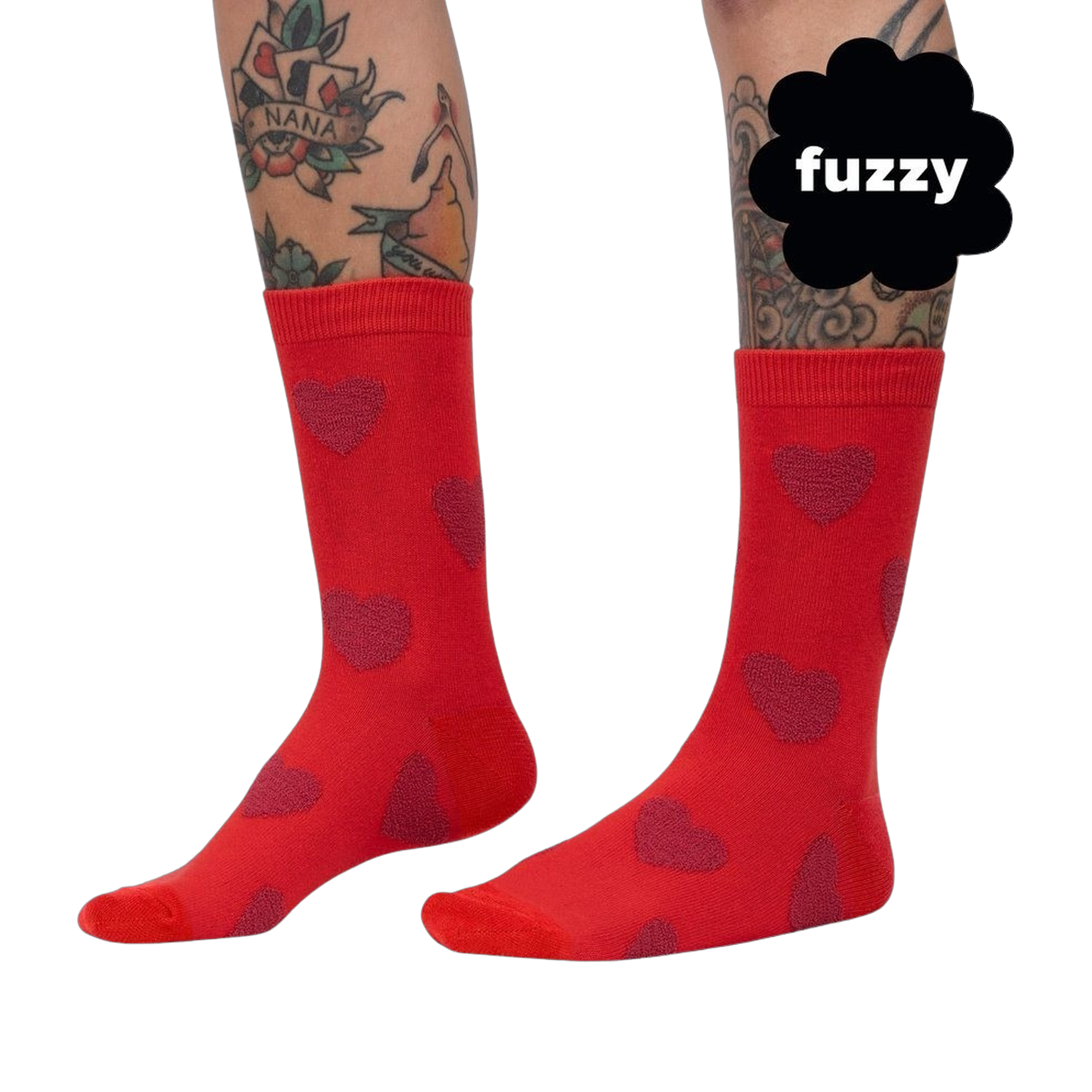 Close-up on a person's legs wearing red crew socks with maroon fuzzy hearts. 