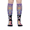 Front view of model wearing a pair of Cosmic Connection knee-high socks.