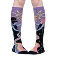 Close-up of model's legs wearing Cosmic Connection knee-high socks.