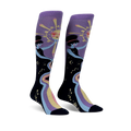 Pair of women's knee-high socks. Purple and black with a celestial design featuring two women, a sun, and a rainbow river of stars.