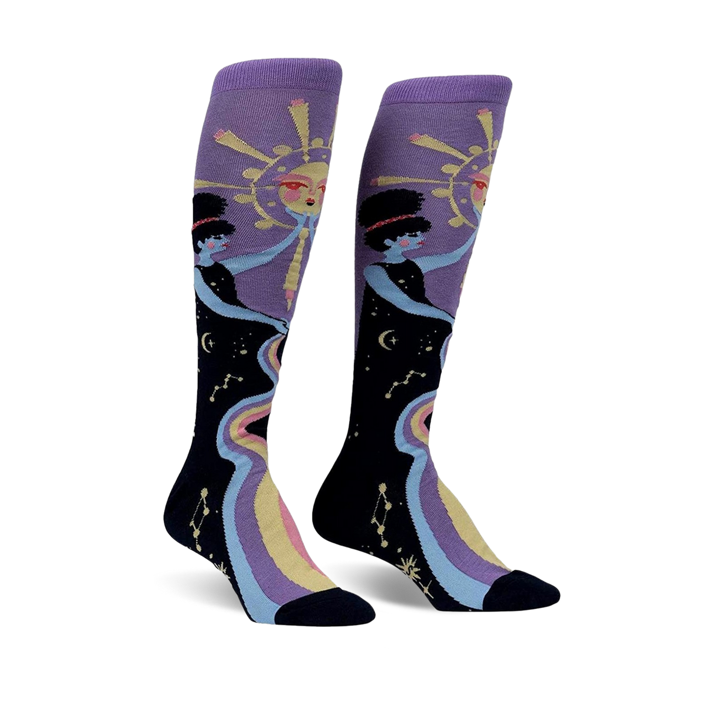 Pair of women's knee-high socks. Purple and black with a celestial design featuring two women, a sun, and a rainbow river of stars.