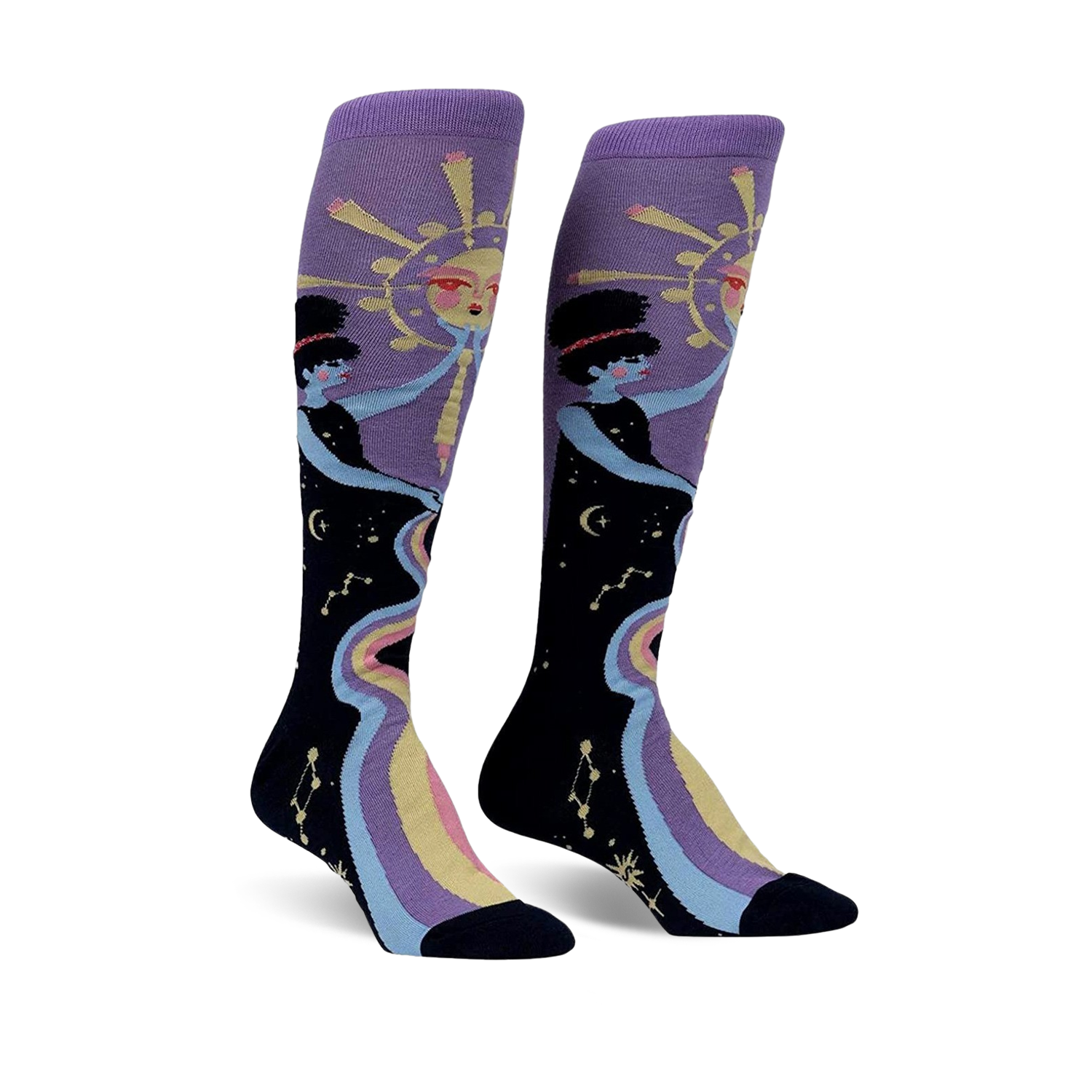 Pair of women's knee-high socks. Purple and black with a celestial design featuring two women, a sun, and a rainbow river of stars.