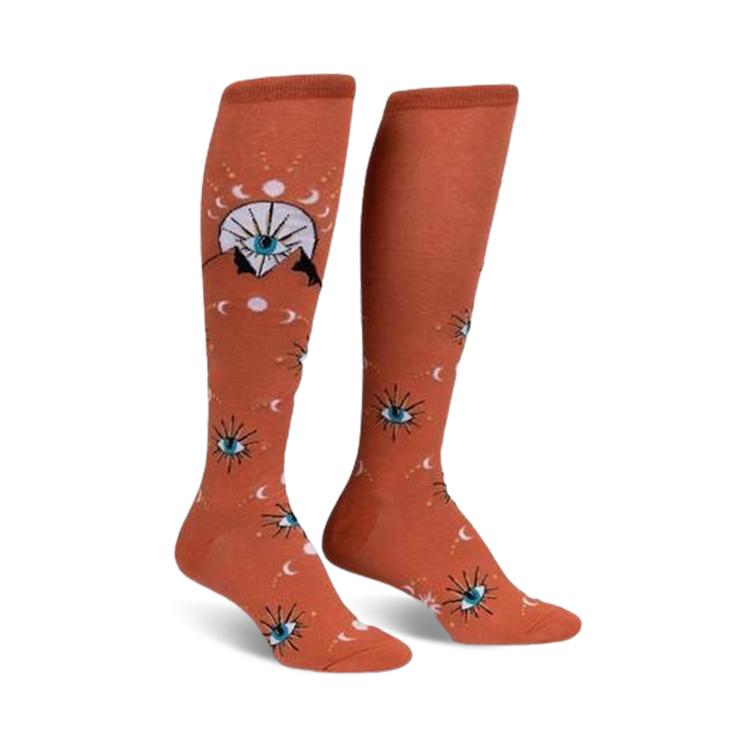 Pair of burnt orange knee-high socks with a repeating pattern of stylized eyes, moons, and celestial symbols.