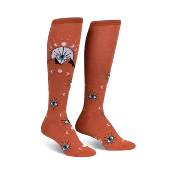 funky orange knee-high socks with a celestial eye, moon, and star pattern in blue, white, and yellow.  