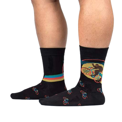Lifestyle shot of Bike-Squatch socks on a person's legs. Shows the socks' fit and design in action.