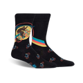 Pair of black crew socks featuring a Bigfoot riding a bike graphic. Smaller bike designs are repeated on the sock.