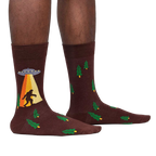 Lifestyle shot of a person wearing the Bigfoot and UFO crew socks. Shows how the socks look on.