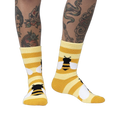 Lifestyle photo showing the Bee Cozy Slipper Socks on a person's legs.