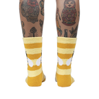 Back view of the Bee Cozy Slipper Socks on a person's legs.