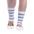 Lifestyle shot of a person wearing the Hey Corgeous Slipper Socks, showing the socks on their feet.