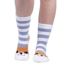 Lifestyle shot of a person wearing the Hey Corgeous Slipper Socks, showing the socks on their feet.