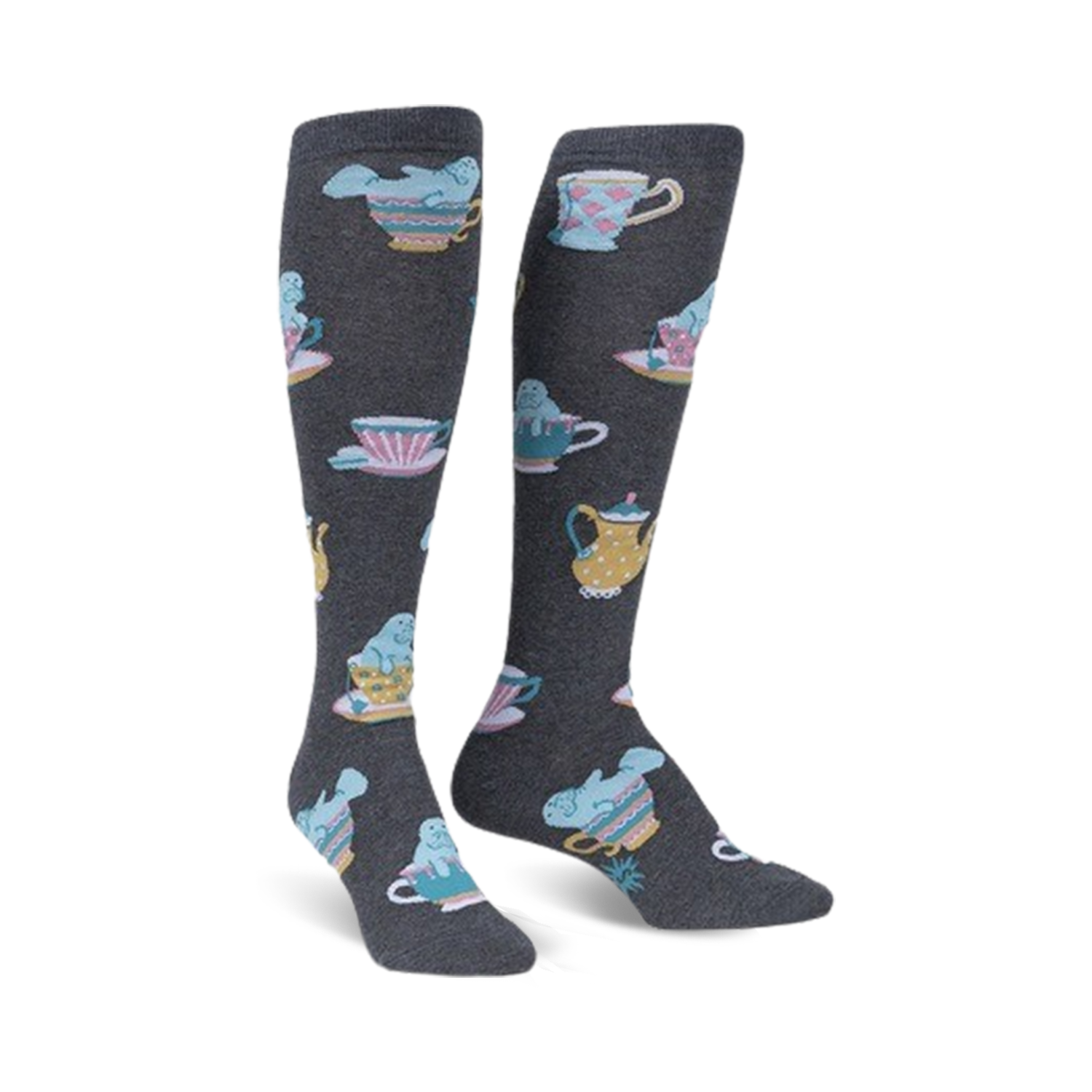 Pair of knee-high socks in dark gray featuring a pattern of manatees relaxing in pastel teacups and teapots.