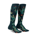 Pair of women's knee-high socks. Deep teal background with embroidered gold and red cacti and succulents.