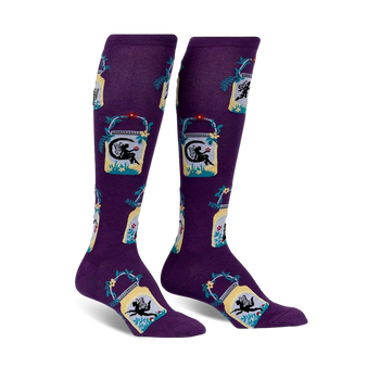 Pair of purple knee-high socks with a repeating pattern of fairies in mason jars, accented with teal and yellow.