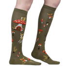 Close-up side view of the socks highlighting the details of the whimsical mushroom houses and woodland creatures.