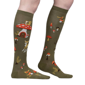 Close-up side view of the socks highlighting the details of the whimsical mushroom houses and woodland creatures.