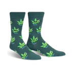 Pair of crew socks in dark teal with a pattern of cartoon marijuana leaves wearing sunglasses and giving peace signs.