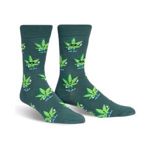Pair of crew socks in dark teal with a pattern of cartoon marijuana leaves wearing sunglasses and giving peace signs.
