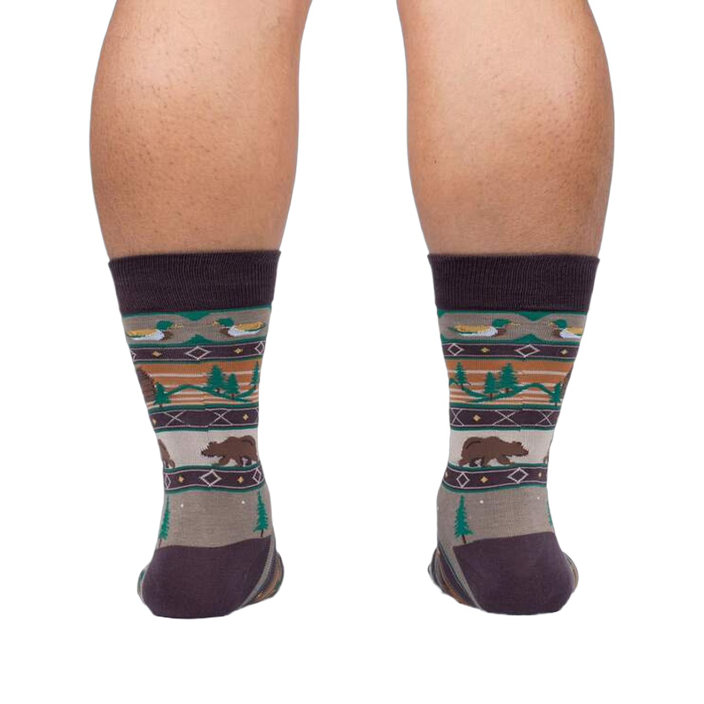 Rear view of a person wearing Cabin Life socks, showing the design on the back of the socks.