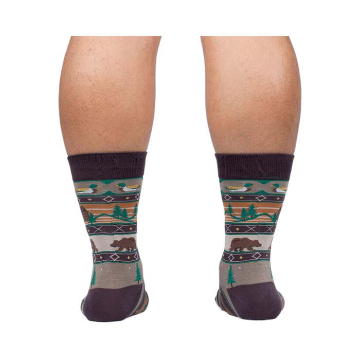 Rear view of a person wearing Cabin Life socks, showing the design on the back of the socks.