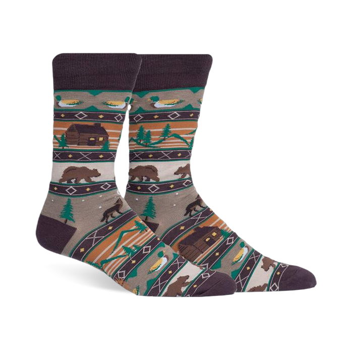 Cabin Life crew socks in brown, tan, and green. Design includes a log cabin, bears, ducks, and woodland scenes.