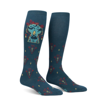 knee-high dark teal women's socks reveal alice from alice in wonderland amid gold keys and red diamonds.  