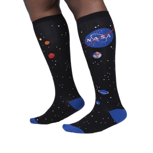 Lifestyle shot showing the socks on a person's legs, highlighting the fit and design.