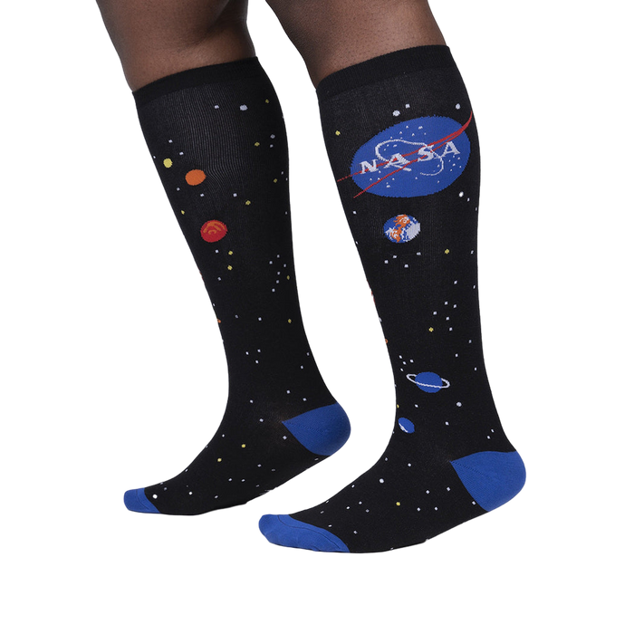 Lifestyle shot showing the socks on a person's legs, highlighting the fit and design.