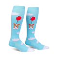 Pair of light blue knee-high socks.  Features a cute corgi dog attached to a red balloon floating amongst white clouds.