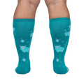 Rear view of teal sheep socks on a person's legs.