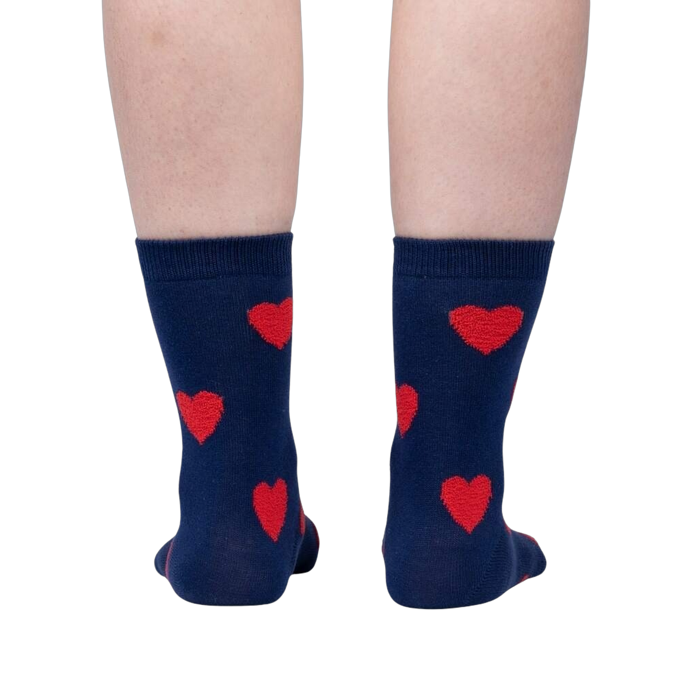 Flatlay image of a pair of red crew socks with maroon fuzzy hearts.