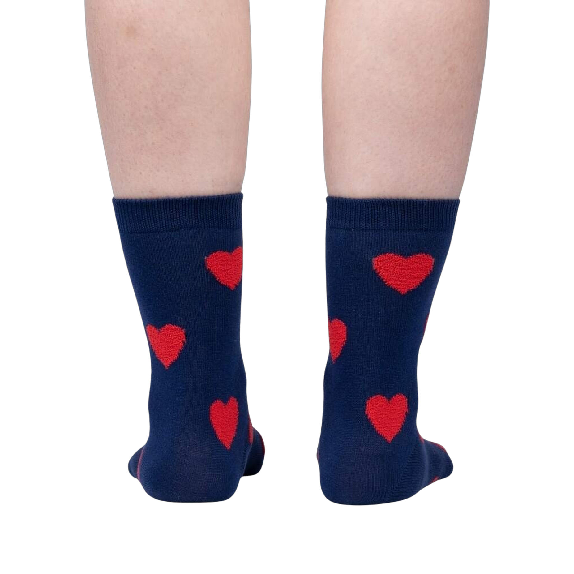 Flatlay image of a pair of red crew socks with maroon fuzzy hearts.
