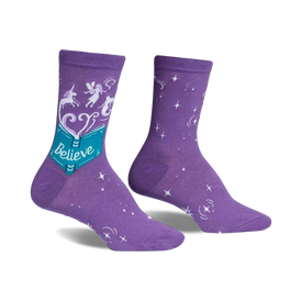 purple crew socks with white stars, blue flowers, a unicorn on the left sock, and a fairy on the right sock. the socks have "believe" written on them and are inspired by the book "the neverending story".  